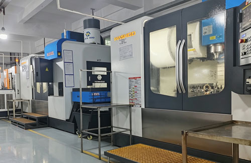 Modern CNC machining workshop with precision milling and turning machines operating in a manufacturing plant